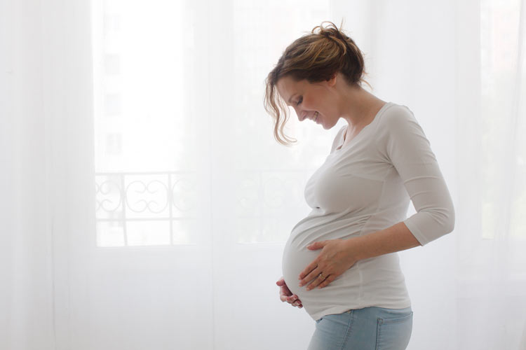 Pregnant woman smiling