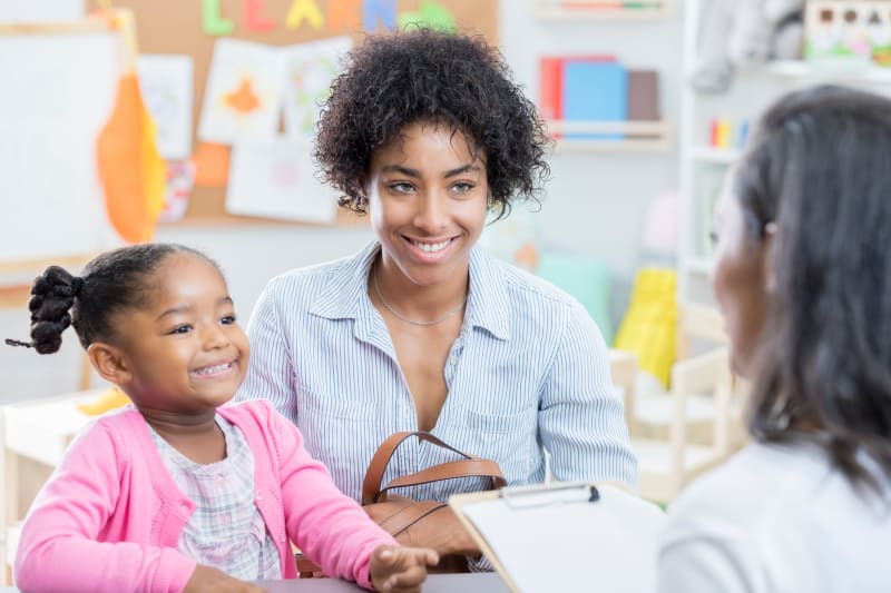 Mother and Daughter meeting with School Staff.