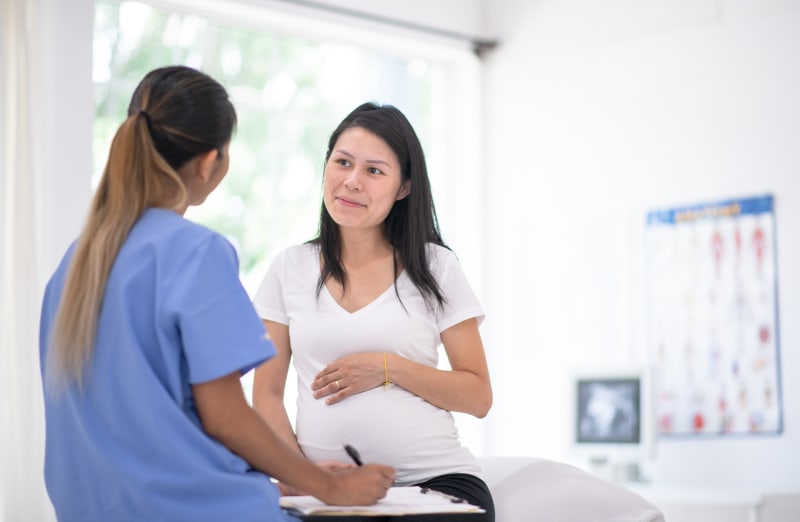 Pregnant Mother talking to Doctor.