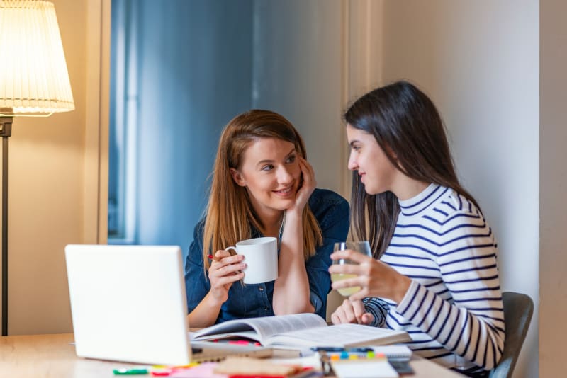 Mom talking to daughter at home.