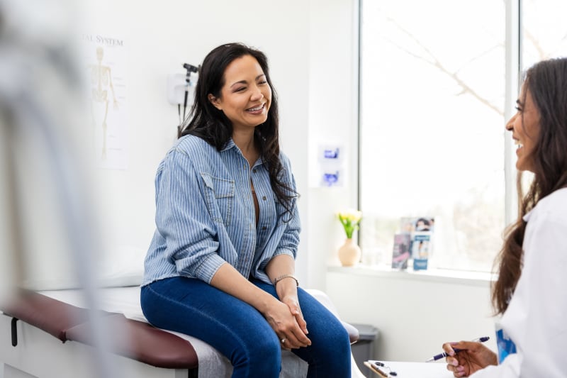 Female patient talking to her doctor.