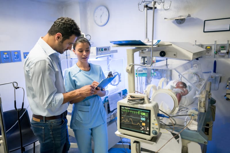 A father talking to doctor in Neonatal Intensive Care Unit.